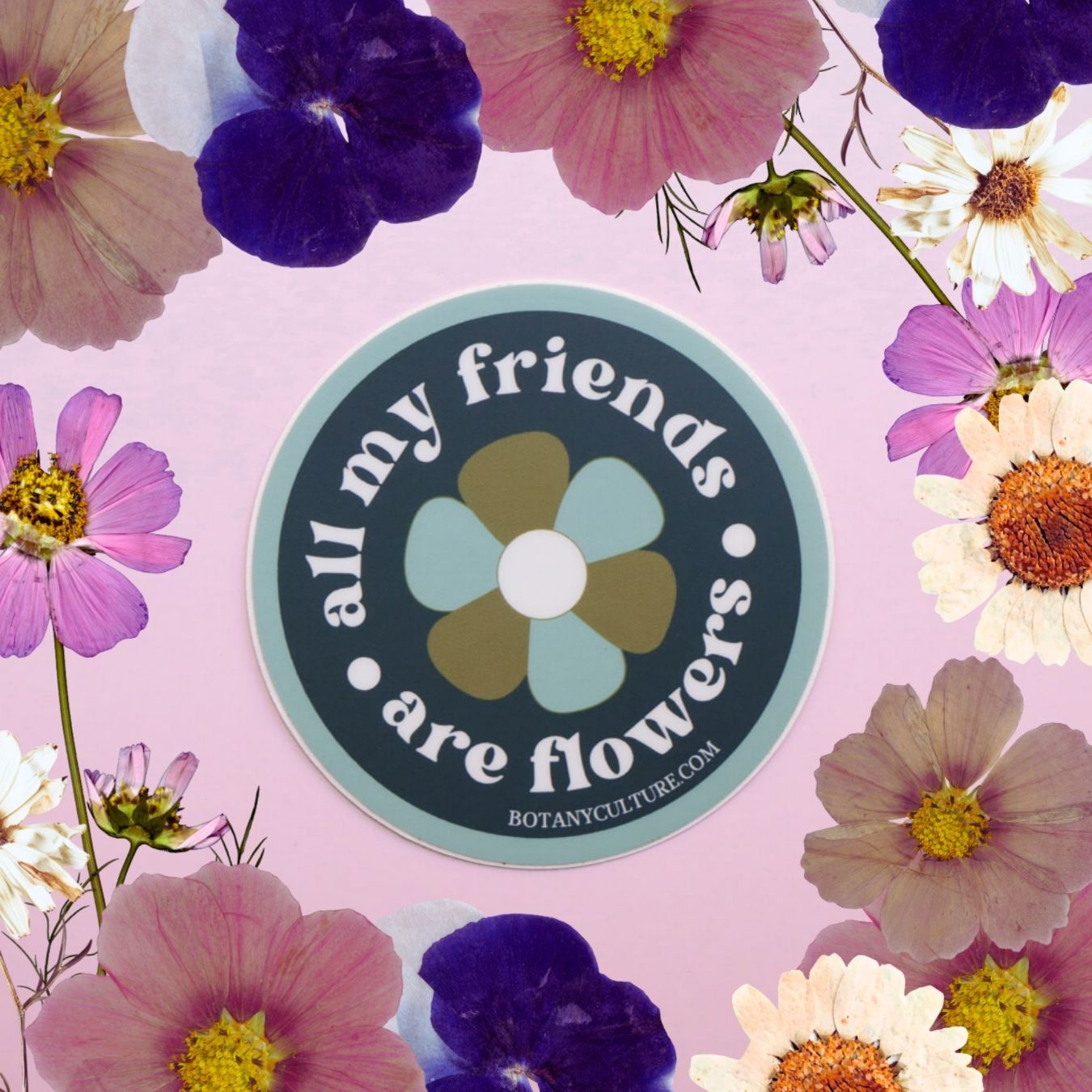 Sticker with a floral design with a circular logo and text on a pink background