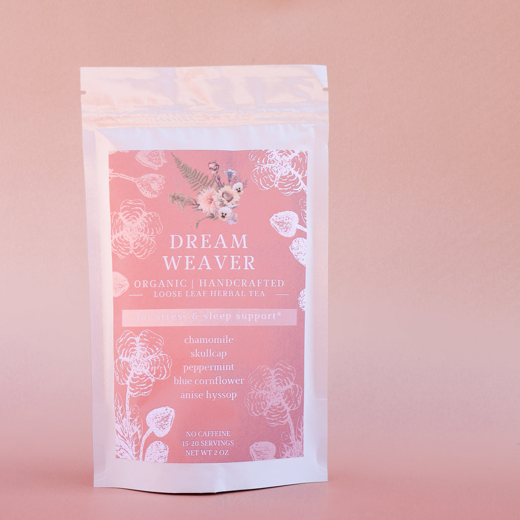 Dream Weaver tea package on a pink background
