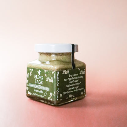 A jar of Elder Sage Herbal Honey Electuary with Reishi for Daily Immune support against a light pink background