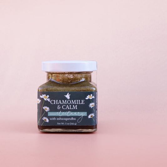 Jar of 'Chamomile & Calm Herbal Honey Electuary with Ashwagandha' on a pink background