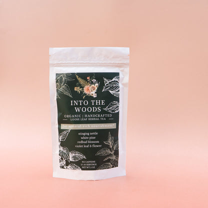 Tea package labeled 'Into the Woods' on a gradient background