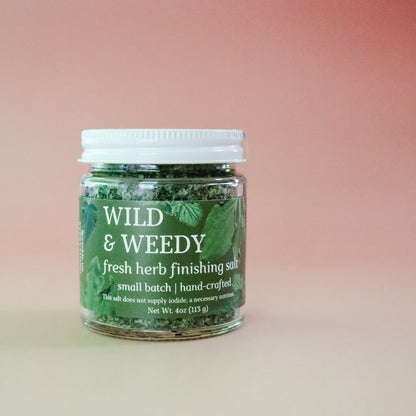 Jar of 'Wild & Weedy' fresh herb finishing salt on a gradient background