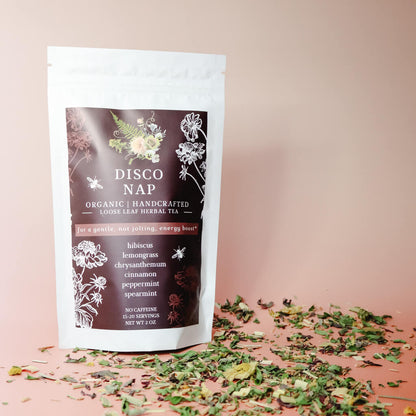 A package of organic loose-leaf herbal tea labeled 'DISCO NAP' with botanical illustrations and text describing the tea's ingredients and purpose