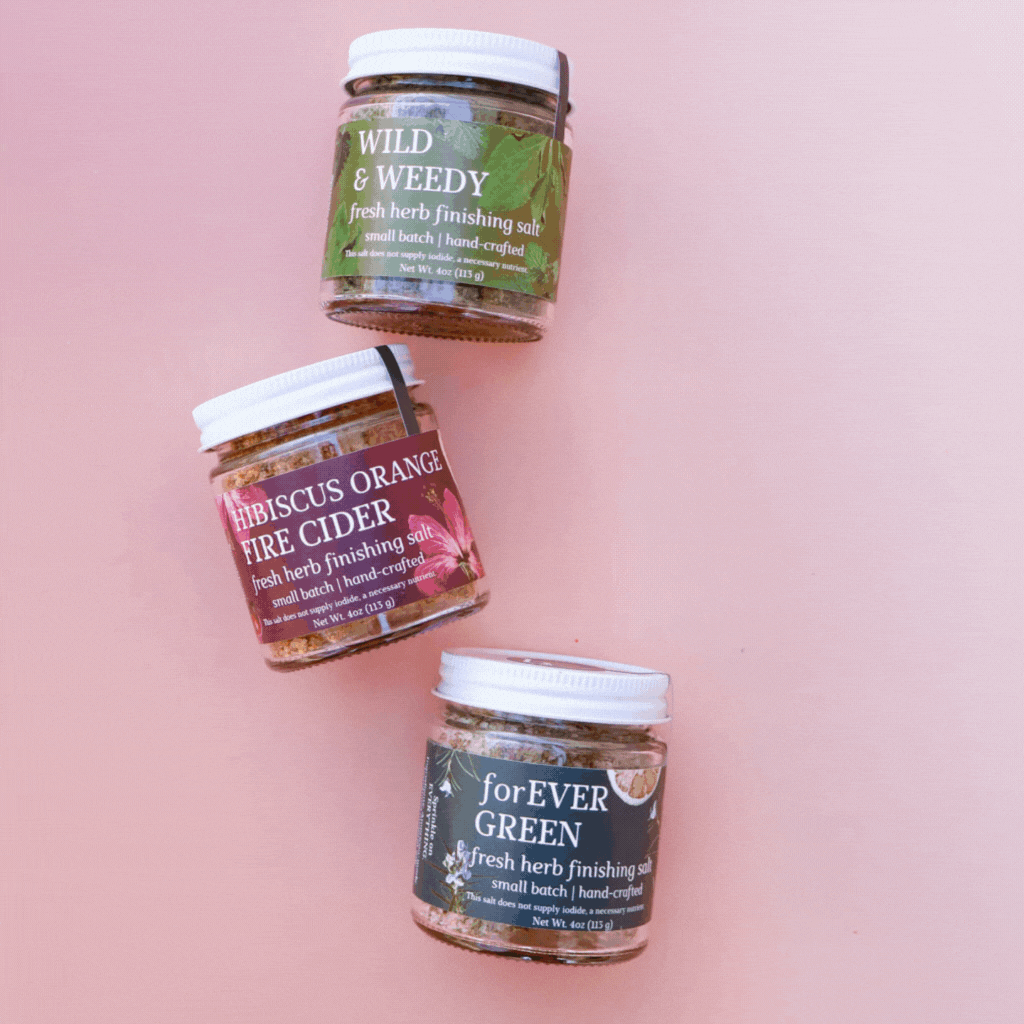 Gif of rotating images of groups of 3 glass jars of fresh herbal finishing salts