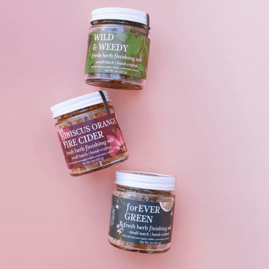 Gif of rotating images of groups of 3 glass jars of fresh herbal finishing salts