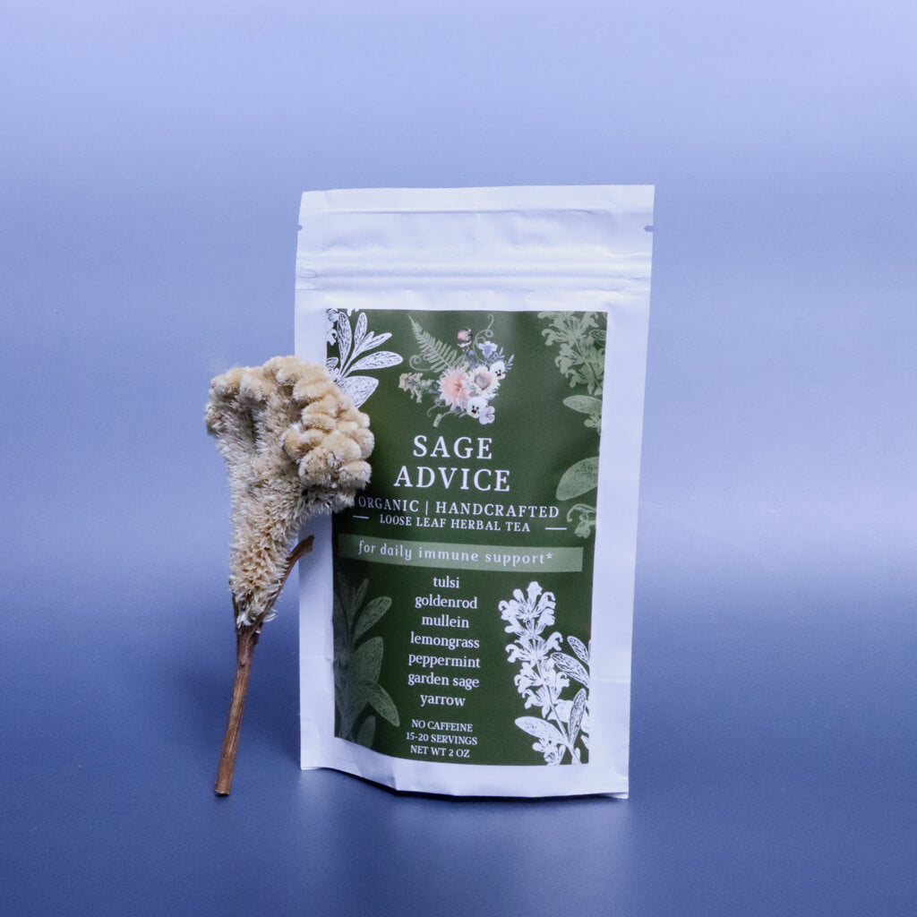 bag of Sage Advice Loose-Leaf Herbal Tea against a blue background and a decorative dried flower