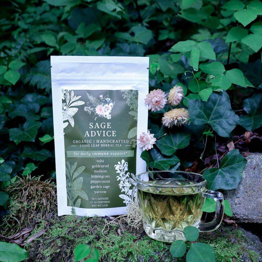Sage Advice organic herbal tea package with a cup of tea in front of green foliage.
